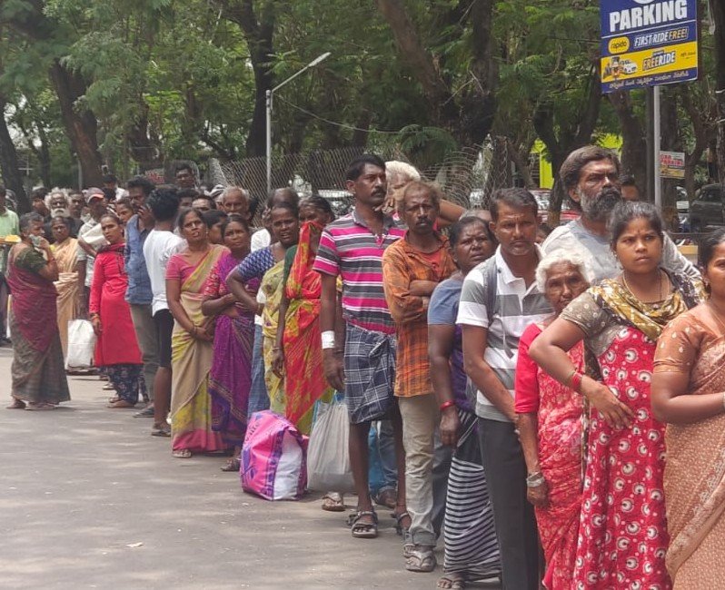 Community members participating in Annadanam