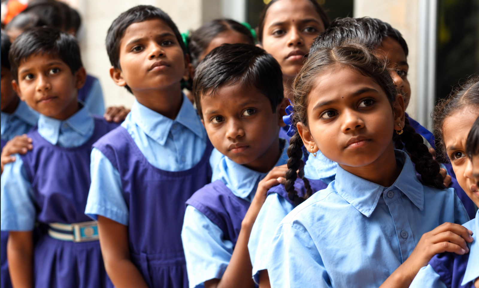 Schoolchildren in uniform receiving educational support